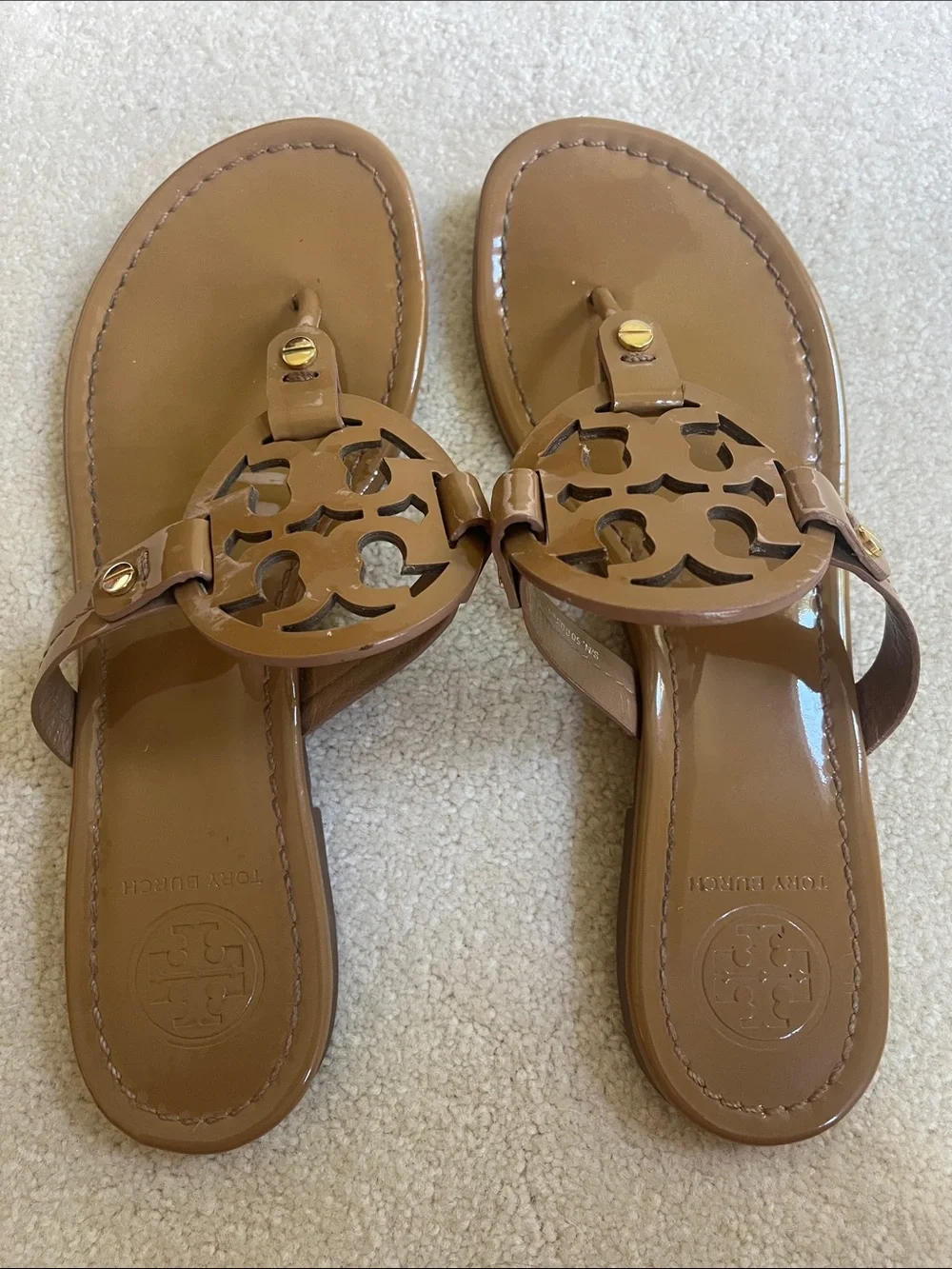 Tory Burch Patent Logo Thong Sandals in Brown